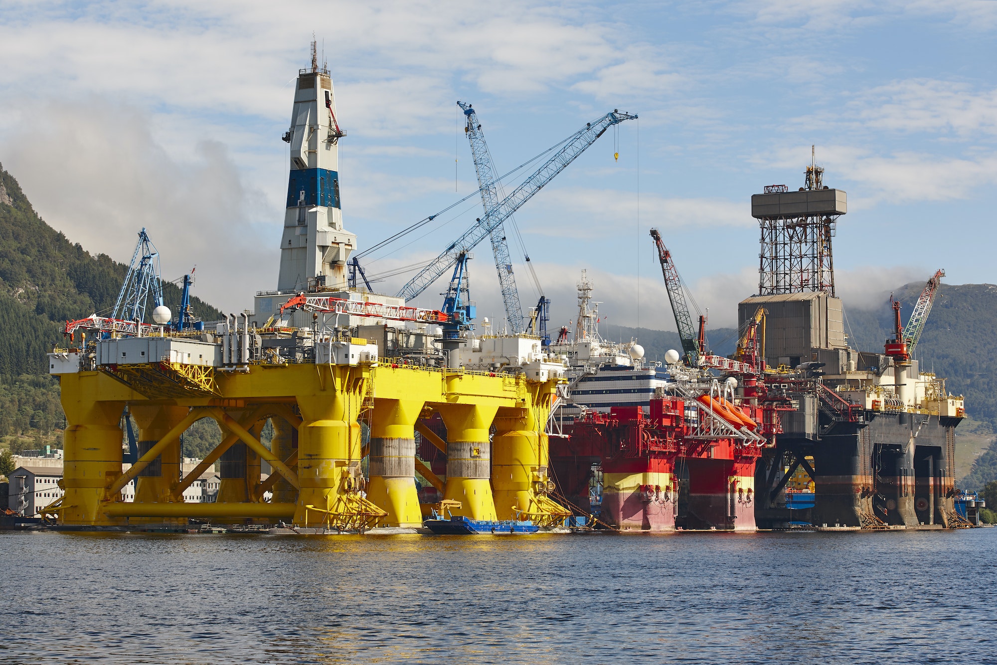 Oil and gas platform in Norway, featuring drilling rigs and support vessels, showcasing the energy industry's infrastructure and petroleum exploration activities.